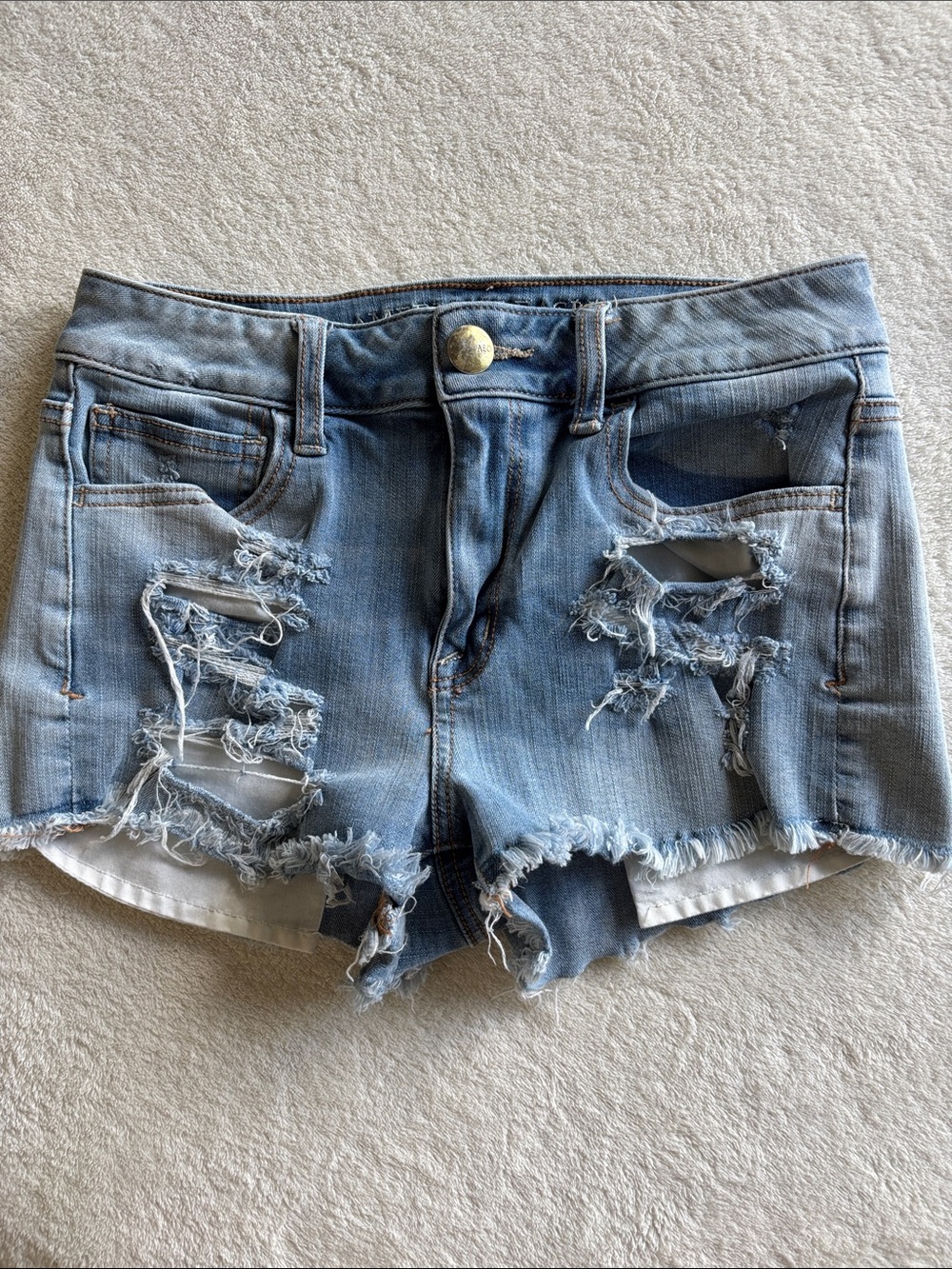 American Eagle cutoff distressed light wash jean shorts size 4